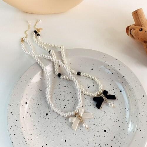 U-Magical Temperament Black White Bowknot Rhinestone Pendant Necklace for Women Trendy Simulation Pearl Beaded Necklace Jewelry
