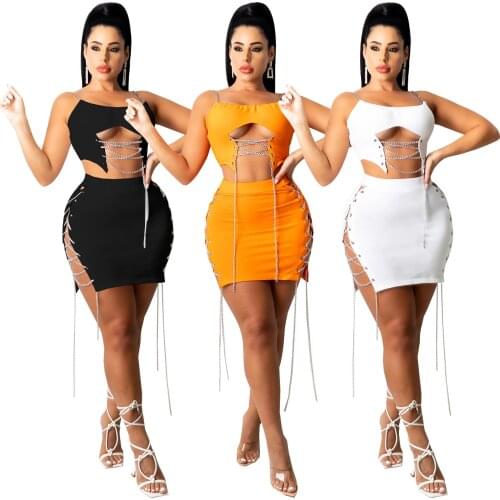 European and American womens summer solid color hanging shoulder corns iron chain split sexy 2-piece short skirt suit nightclub