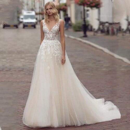Sexy O Neck Champagne Wedding Dresses 2021 Wedding Gowns A Line Lace Appliques Sleeveless Bridal Gown Backless Robe De Mariee