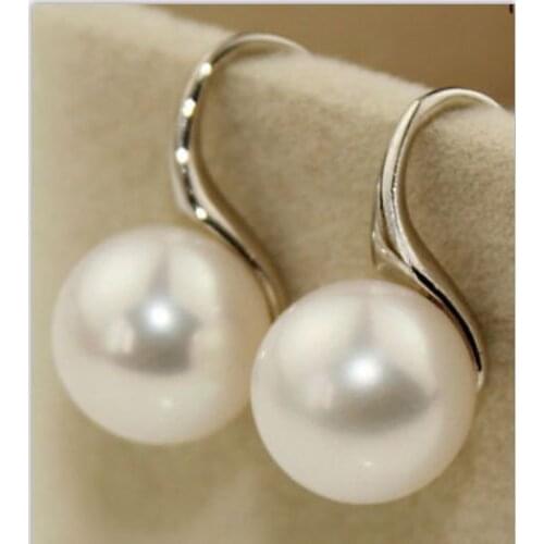 A pair of round 1011mm AAA natural south seas white pearl earrings silver