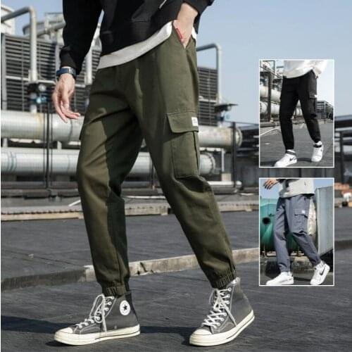 Autumn and winter new overalls mens solid color wild youth loose fashion casual pants mens Japanese tie