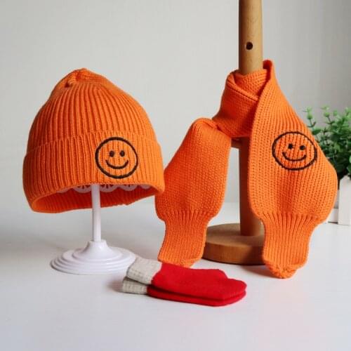 A three-piece set of childrens hat and scarf gloves for autumn and winter Boys and girls cute candy color smiley hats Baby hat