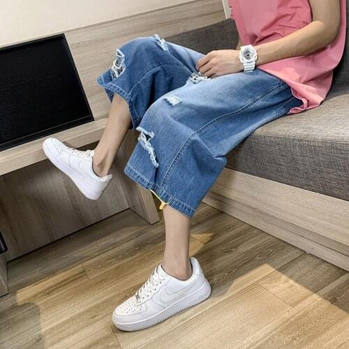 Couple style loose wide-leg cropped jeans tide brand Hong Kong style wild straight hole pants denim shorts