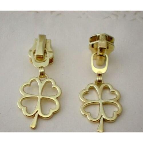 Free shipping 10pcs/lot 5# gold High-grade metal zipper head pull bags clothing clover Zip head use for resin zipper