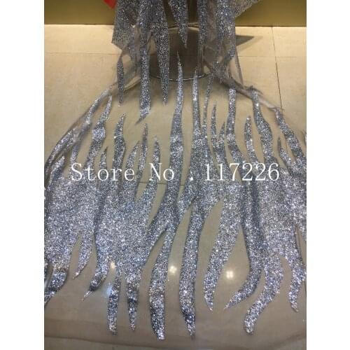New design hot sale embroidered mesh material with glued glitter French net lace fabric for sexy dress