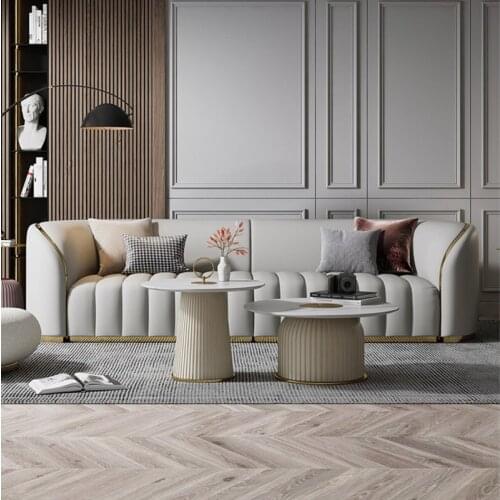 Light luxury leather sofa, simple modern small family living room, creative head leather, post modern three person leather sofa