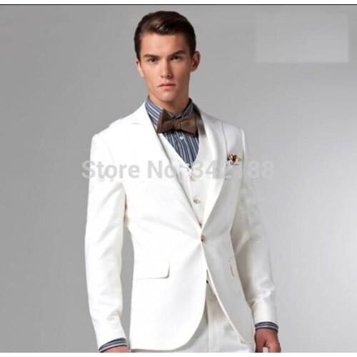 - New Style White Two Buttons Groom Tuxedos Best Man Peak Lapel Groomsmen Men Wedding Suits Bridegroom (Jacket+Pants+Tie+Vest)we