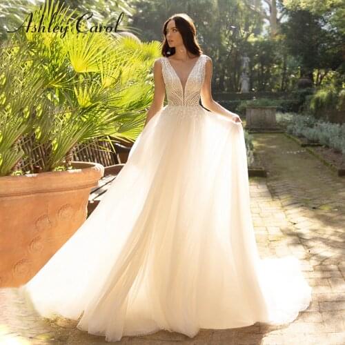 Ashley Carol A-Line Wedding Dress 2021 Glamorous Backless V-Neck Bride Beading Appliques Shiny Tulle Sleeveles Beach Bridal Gown