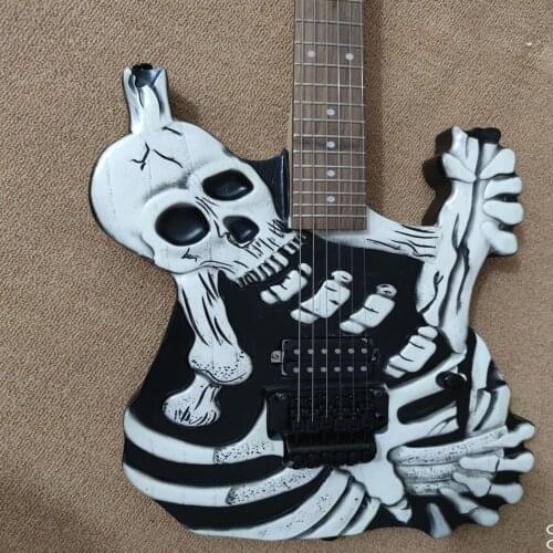 New hand carved electric guitar, Skull Guitar, black hardware with vibrato system, free transportation