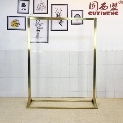 Stainless Steel Gold Display Frame in Landing Side Hanger of High-end Clothing Store Womens Clothing Store