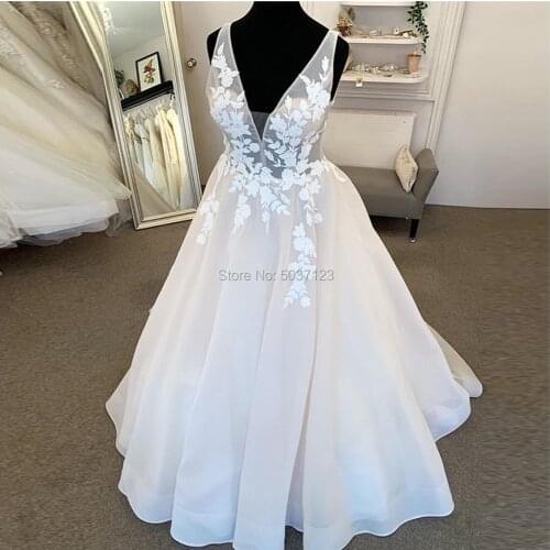 2020 Deep V-neckline Wedding Dresses Illusion Bodice Romantic Appliques Floor Length Bridal Dress Backless Long Robe De Mariee