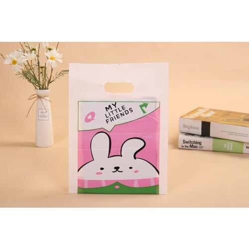 100psc Handbag clothing plastic handbag boutique bag hand bag four finger bag clothing store bag