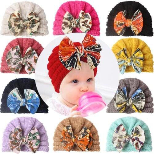 1pcs Baby Autumn Winter Printing Bowknot Hat Soft And Warm Childrens Hat Baby Knitted Wool Cap Kids Keep Your Head Warm