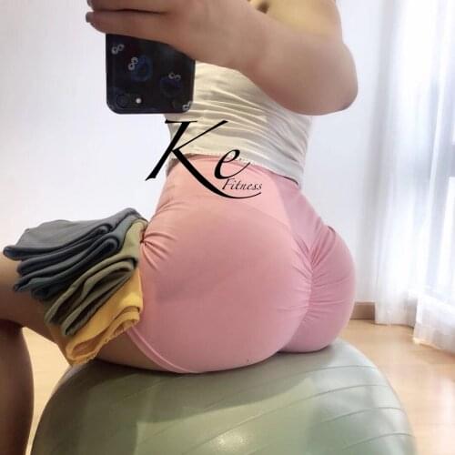 KE pink yellow sexy peach hip fitness net red shorts hip folds hip yoga running bag hip shorts