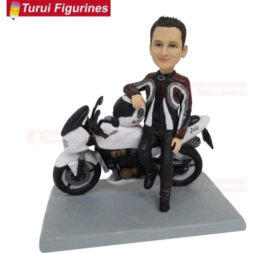 Man wear jumpsuit and his motorbike figurines sculptures dolls statuette motorcycle birthday cake stand