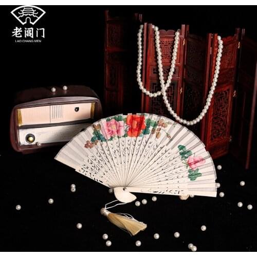 The old ox bone hand-painted folding fan