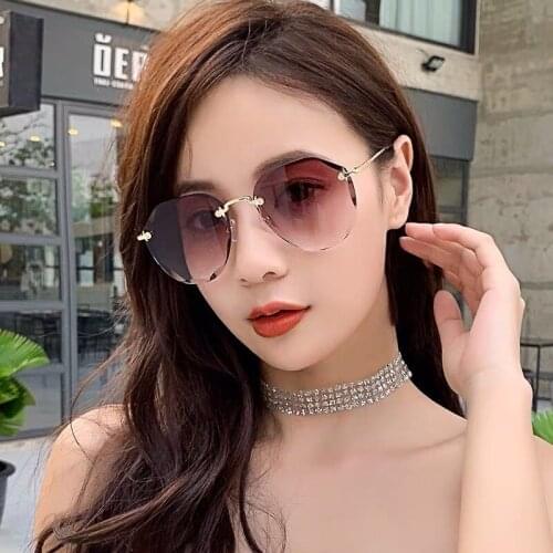 Sunglasses womens rimless glasses sunglasses womens European and American trimming big frame mirror