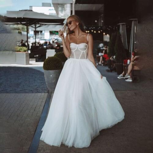 White Ivory Sexy Wedding Dresses 2020 A-line O Neck Bridal Gown Sleeveless Vestidos de Noivas Floor Length Backless Button