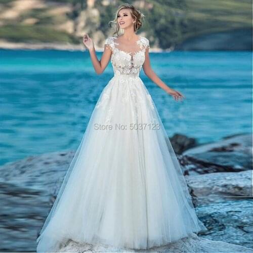 2020 Beach A Line Tulle Wedding Dresses Robe De Mariée Cap Sleeves Lace Appliques Button Illusion Bridal Gown Vestido De Noiva