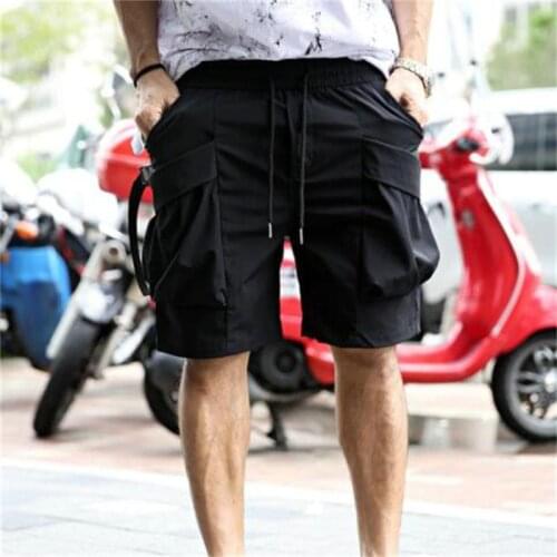 2021 Korean fashion mens new solid color large pocket asymmetric fashion casual Shorts Large Size tooling pants