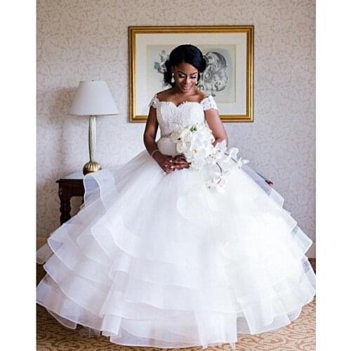Gorgeous White Tiered Fluffy Ruffles Wedding Dress Beading Cap Sleeves Backless Custom Made Bride Wedding Dresses