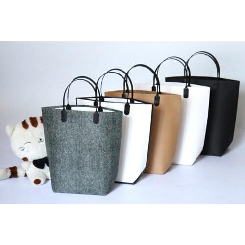 100PCS/LOT Paper Gift Bag With Film Plastic Handle Clothes Packaging Shopping Portable Bag