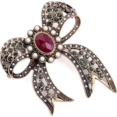 New fashion trend jewelry retro hollow imitation pearl semi-precious stone bow brooch female