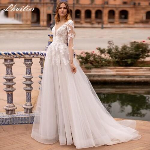 Lhuilier A-line V Neck Tulle Wedding Dresses 2020 Open Back Full Sleeves Sweep Train Floor Length Bridal Dress with Flowers