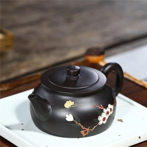 Marked tea pot handmade master pot real yixing zisha black clay original ore purple grit floral relief kungfu tea pots in China