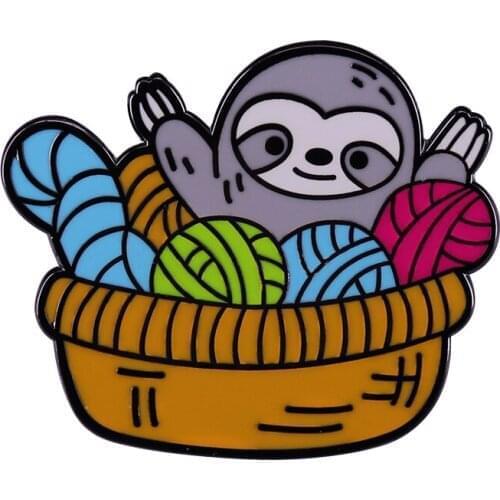 Brighten up your day with this cheeky sloth in a yarn basket enamel pin! Perfect for knitting lovers yarn hoarders and crafters