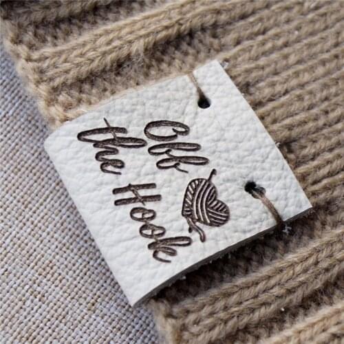 Knitting labels, center fold leather labels, crochet labels, folding labels, leather tags, branding logo labels