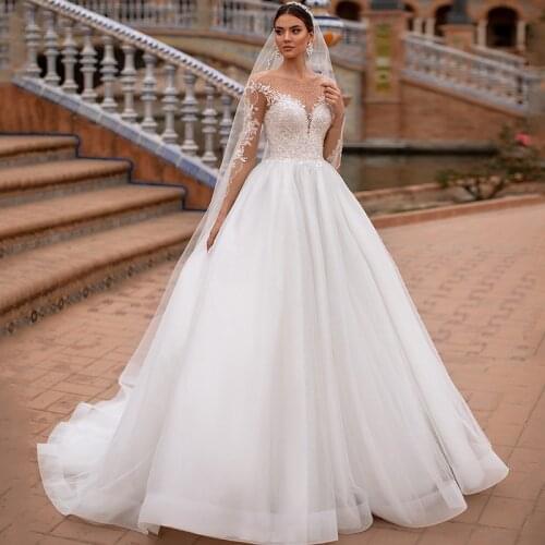 2021 Elegant Ball Gown Wedding Dresses O Neck Long Sleeve Beads Lace Bridal Dress Princess Church Wedding Gowns Illusion