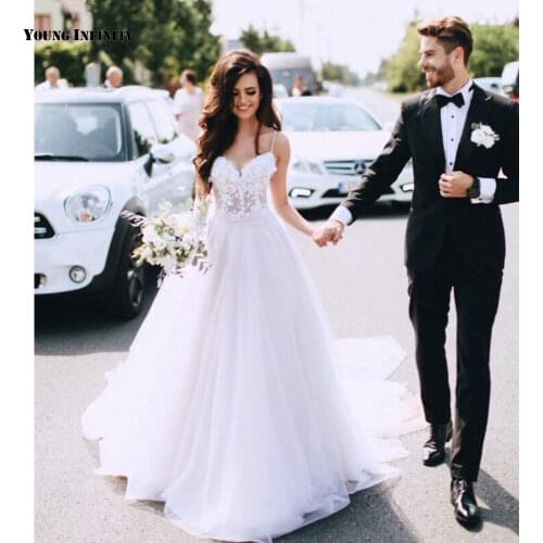 Charming Ball Gown Wedding Dresses 2021 Sleeveless Bridal Gown Backless Sweetheart Chaple Train Applique White Plus Size Bride