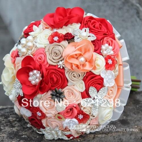 Beautiful red theme bouquet, outdoor wedding the bride holding flowers, fabric, pearls, jewelry lace bouquet, handmade