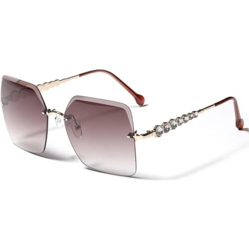 Veshion Rimless Glasses for Women Retro Style Big Frame Sunglasses Uv400 Rhinestones Decoration Metal Gold Tinted Lens 2021