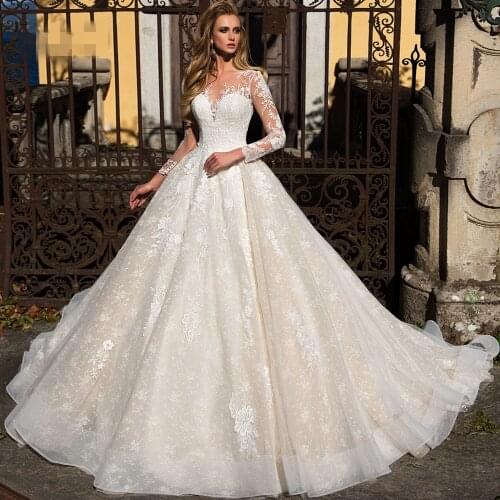 Fashion Ball Gown Princess Wedding Dresses Illusive Long Sleeve Lace Appliqued Bridal Gowns
