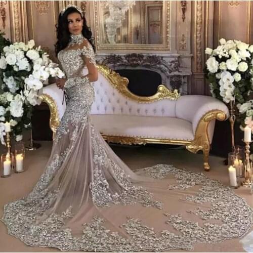 Dubai Arabic Luxury Sparkly 2021 Wedding Dresses Sexy Bling Beaded Lace Applique High Neck Illusion Long Sleeves Mermaid Vintage