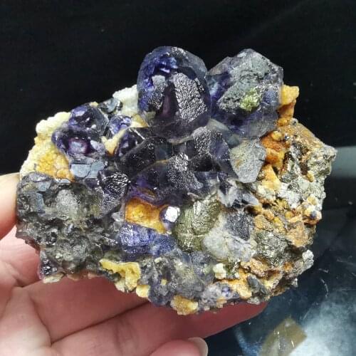 244.2gNatural purplish fluorite and chalcopyrite minerals coexist with quartz gem in the energy room of mineral specimen