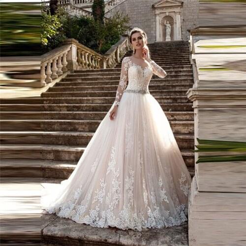 Sheer Scoop Long Sleeves Lace Appliques Wedding Dresses Buttons Back Princess 2020 Modest Bridal Gowns Crystal Beaded Waistline