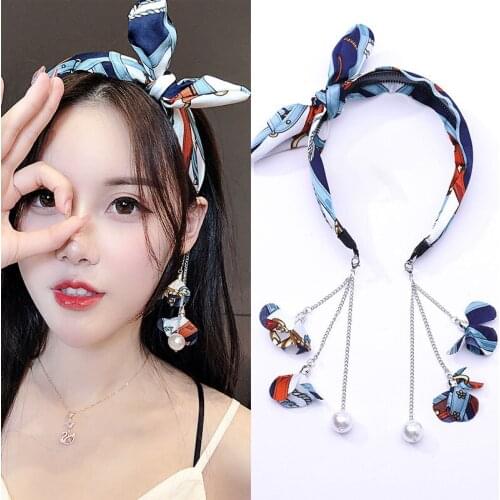 Korean version of the bowknot fake earrings pearl hair band net red tassels cute simple wild hair band little fairy dedicated