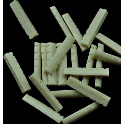 Lots of 50 pcs Acoustic Guitar Slotted Nuts Upper Saddles Bridge Beige