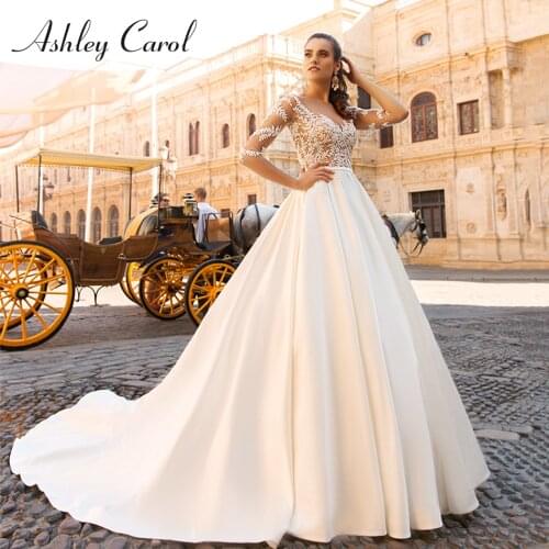 Ashley Carol A-Line Wedding Dress 2021 Dreamy Beaded Appliques Sweetheart Long Sleeve Bride Satin Backless Princess Bridal Gown