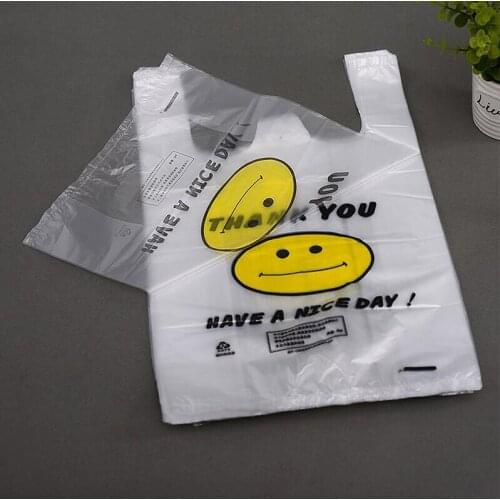 100pcs/lot 3D Supermarket Yellow Lovely Smile White Vest Plastic Carrier Shopping Hand Bag Packaging Bags