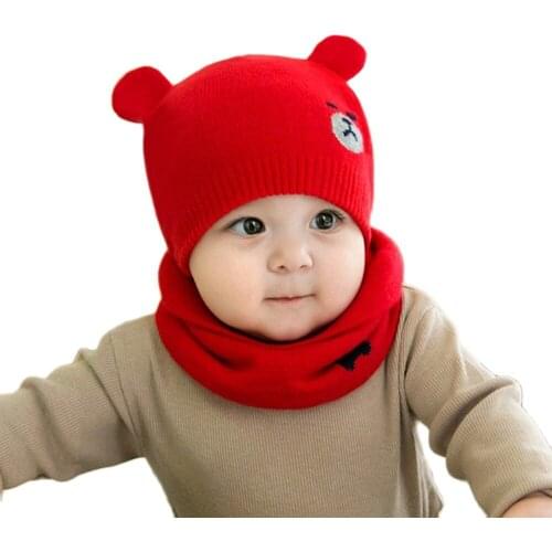 Set of hat and knitted scarf for cold, for boy from 0 to 6 months. Baby winter hat. Hats of teddy bears