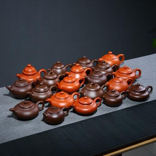 Yixing raw ore, cement, three legged jade milk, purple sand pot, low-grade manual teapot, one for sale agent