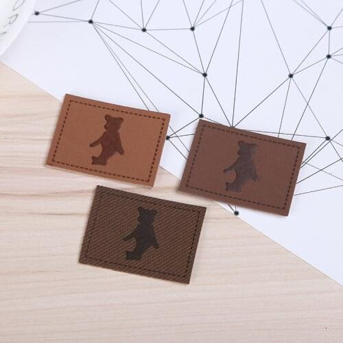 Custom private logo clothes caps PU leather label embossed logo brown leather patch for jeans