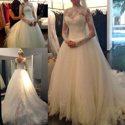 Sexy New Sheer Lace Long Sleeves Zipper Back A-Line Wedding Dresses 2021 High Neck Tulle Applique Beaded Bridal Gowns