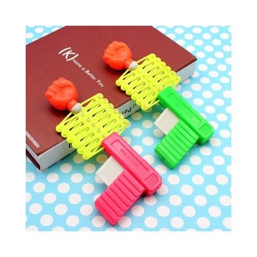 Childrens toy gun Creative telescopic fist gun Mini funny elastic gun Spring magic gun small toys