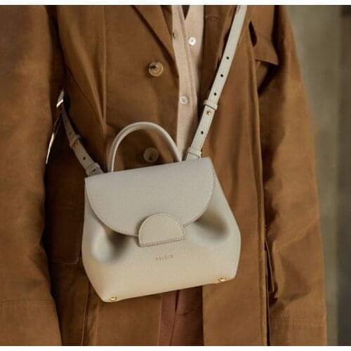 French niche round spot engraved Genuine leather bag womens shoulder messenger handbag trend