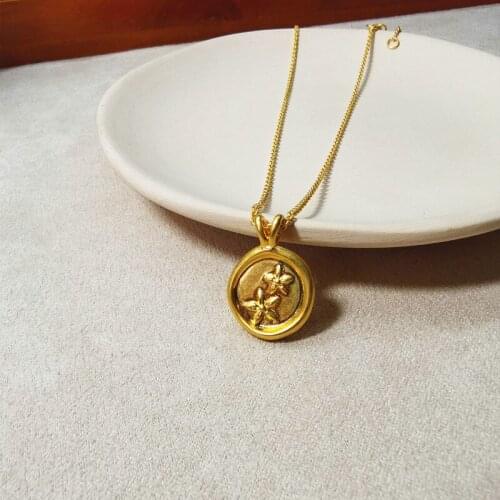 Bauhinia flower pendant necklace European and American retro brass cold wind round gold coins